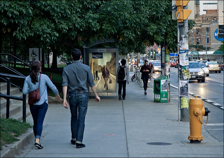 Pedestrians and Bus Stop || Canon5D2/EF24-105f4L@1-5 | 1/50s | f5.6 | ISO800